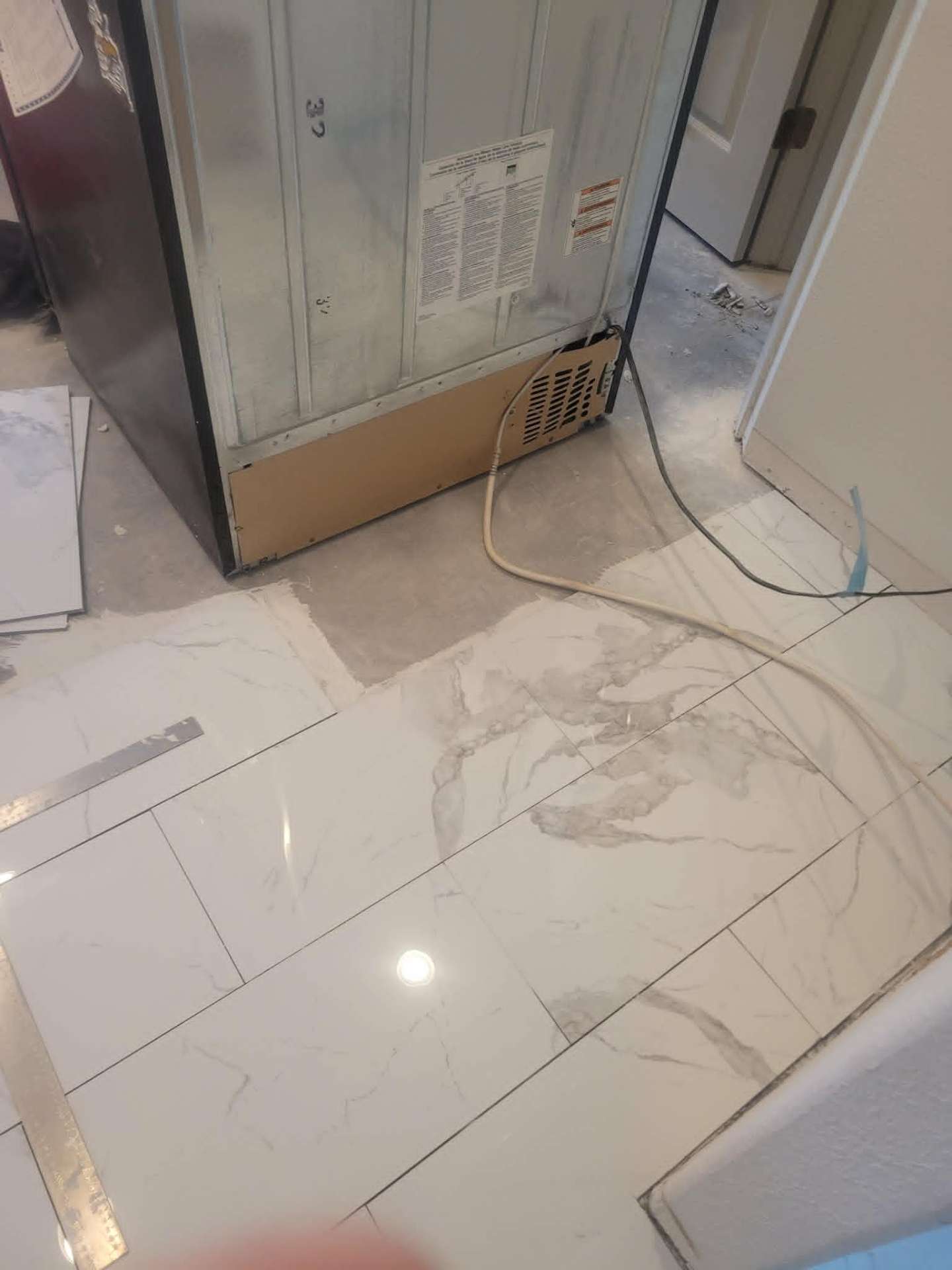 Marble-look porcelain tile flooring installation